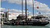 America's Cup 2003: A huge spectator fleet farewells Team New Zealand and Alinghi Swiss Challenge as they head to the racecourse on the first day of competition.