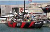 America's Cup 2003: A huge spectator fleet farewells Team New Zealand and Alinghi Swiss Challenge as they head to the racecourse on the first day of competition.