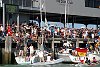 America's Cup 2003: A huge spectator fleet farewells Team New Zealand and Alinghi Swiss Challenge as they head to the racecourse on the first day of competition.