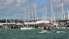 America's Cup 2003: A huge spectator fleet farewells Team New Zealand and Alinghi Swiss Challenge as they head to the racecourse on the first day of competition.