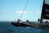 Team NZ grinds to a halt as its headsail takes a dunking, while Alinghi sails off to the top mark.
