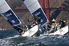 Ben Ainslie (GBR), Emirates Team New Zealand, flies the protest flag as he pursues Staffan Lindberg (FIN) Alandia Sailing Team up the beat.
