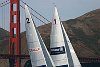 The Golden Gate Bridge and the hills of Marin County provide a dramatic backdrop to the sails of the J105s.