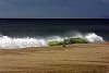 An offshore breeze lifts the surf on Mt Maunganui Beach.