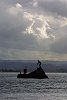 A statue of a Maori warrior protects the entrance to Tauranga Harbour.