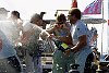 Alinghi wins the Louis Vuitton Cup let the celebrations begin<br><br>Alinghi pitman Josh Belsky lets rip with the Moet et Chandon.