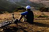 Mountain Biker takes a break on a hill in San Francisco.