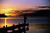 Fly fishing at sunset on a lake in New Zealand