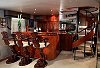 The circular staircase features at the bar end of the main salon on Eagle III.